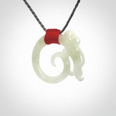 This is a hand carved Snow Jade dragon pendant. This is a medium sized necklace and is provided with an adjustable silver grey cord. Hand carved white jade dragon necklace for men and women.